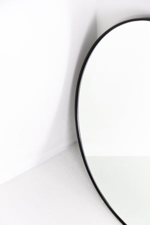 Curved rectangular black frame mirror