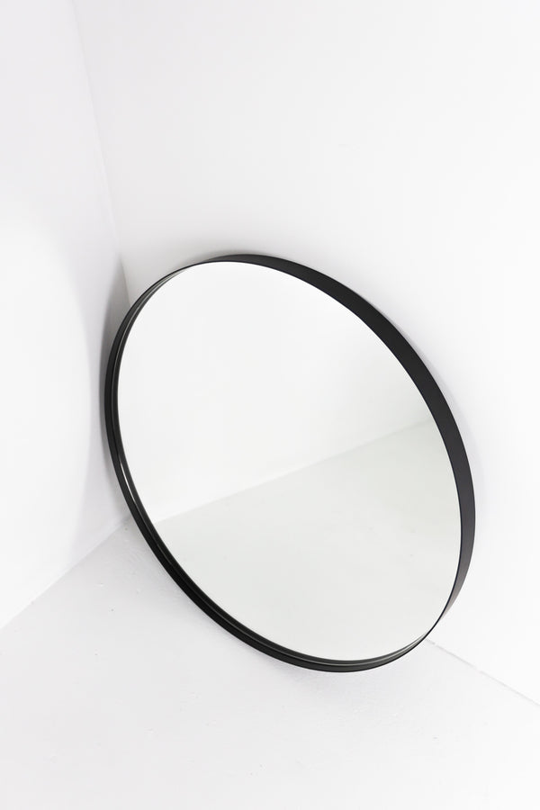 Round mirror set back in black frame - The Framing Project