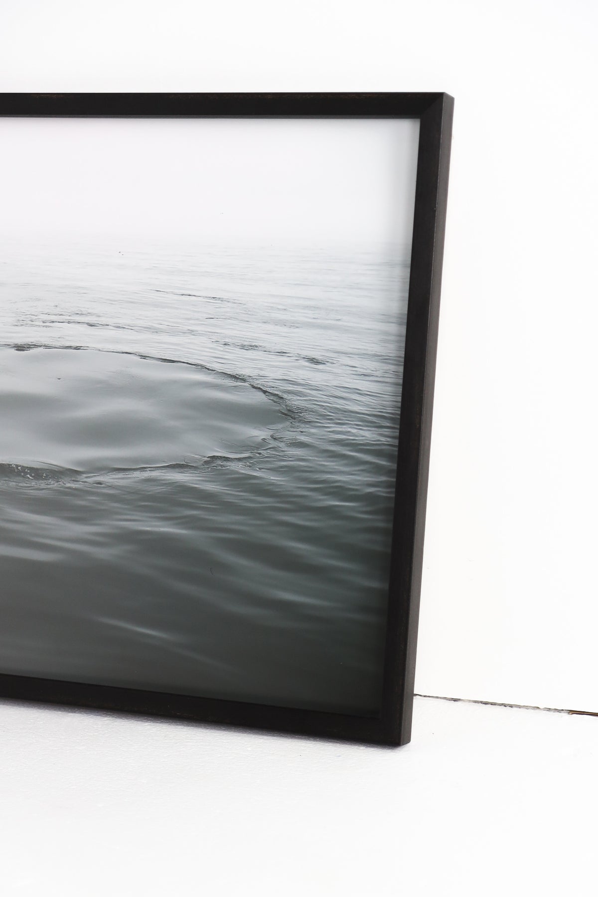 Water ripples framed in black frame