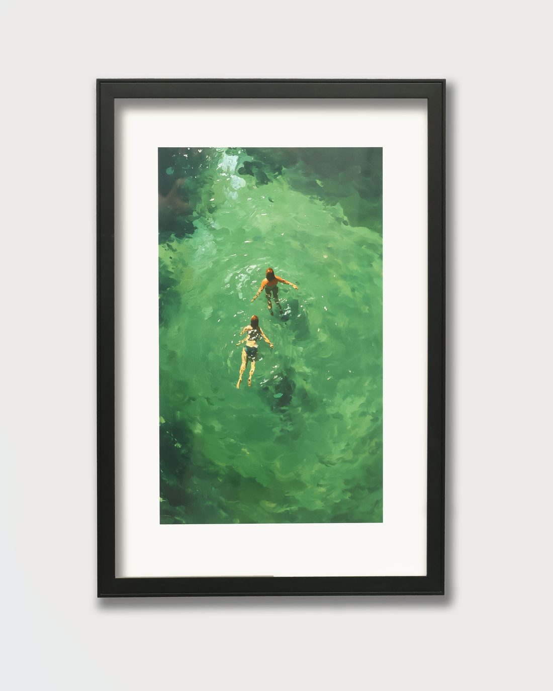 The painting set back in a deep black box frame behind a mat board border