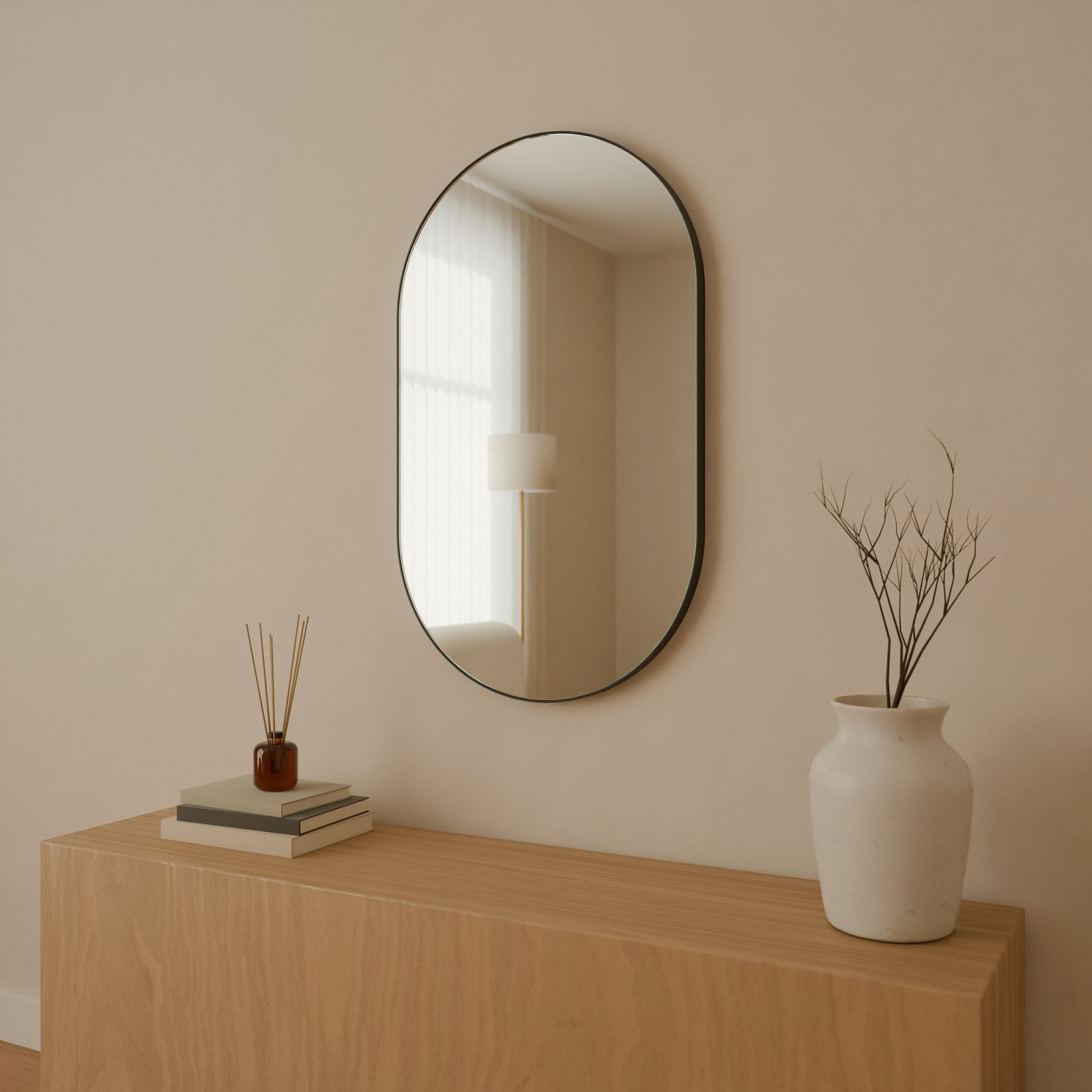 Pill mirror, Metal · Black, in a room