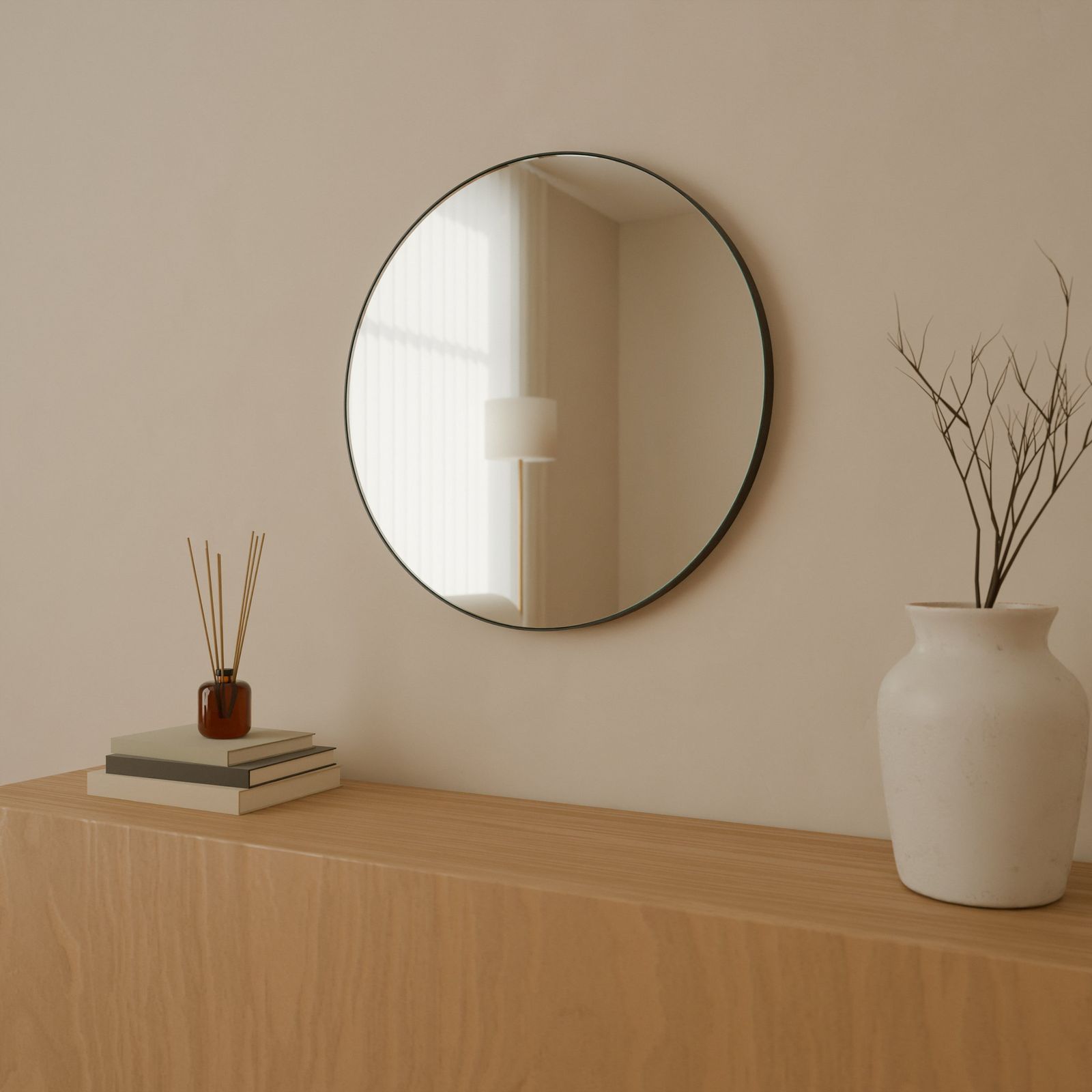 Round mirror, Metal · Black, in a room